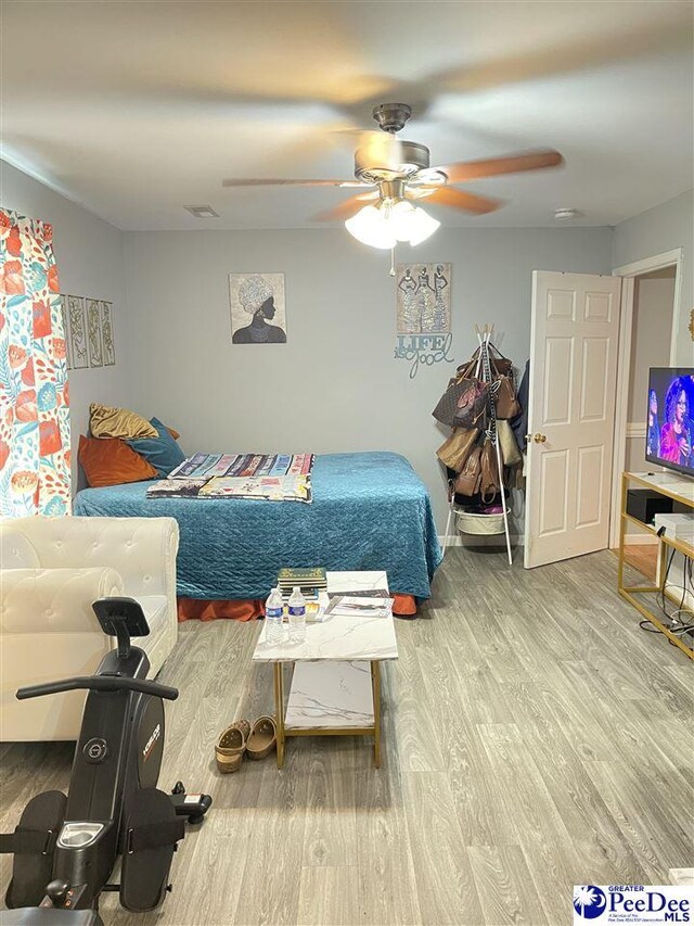 3007 Colton Dr, Florence, SC 29506 - bedroom with wood finished floors, baseboards, and ceiling fan