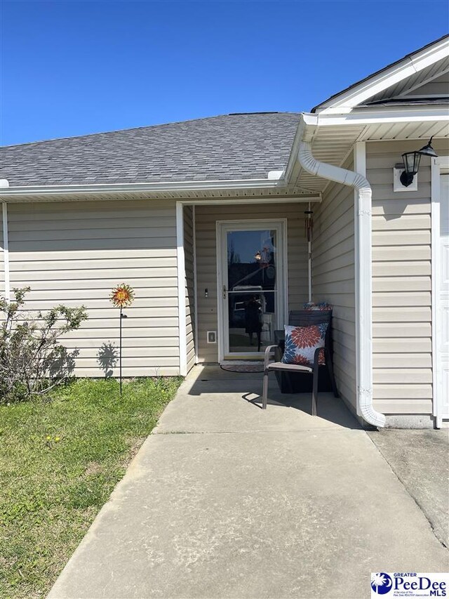 3007 Colton Dr, Florence, SC 29506 - entrance to property featuring roof with shingles