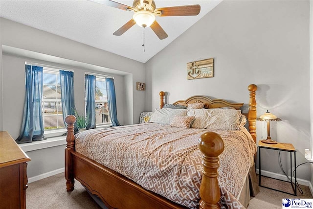 carpeted bedroom featuring ceiling fan and vaulted ceiling