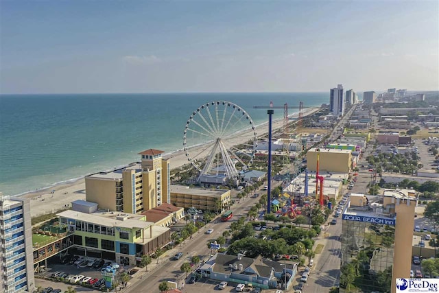 bird's eye view with a water view and a beach view