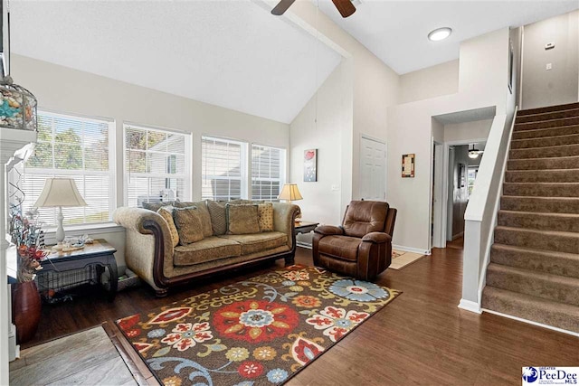 living room featuring ceiling fan, high vaulted ceiling, and dark hardwood / wood-style flooring