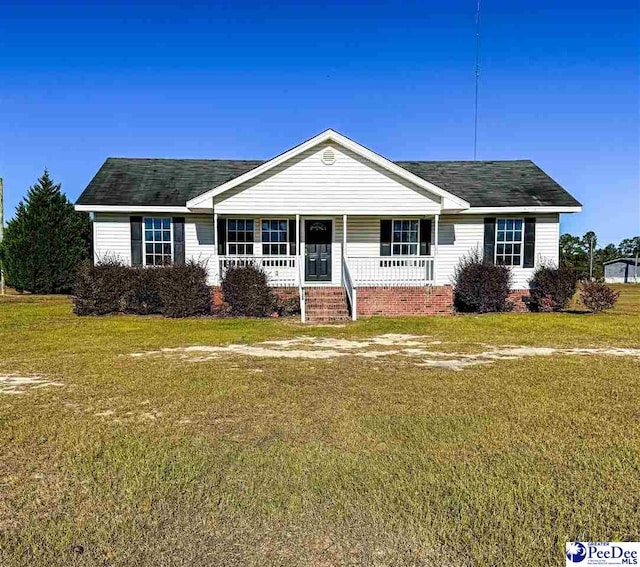 ranch-style home featuring a front yard and a porch