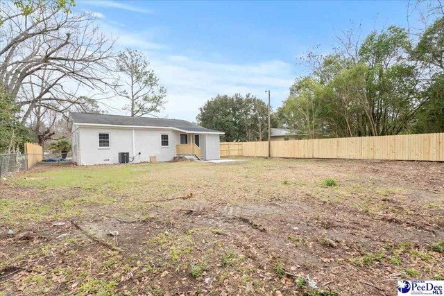236 Wells St, Lake City, SC 29560 - view of yard with cooling unit and a fenced backyard