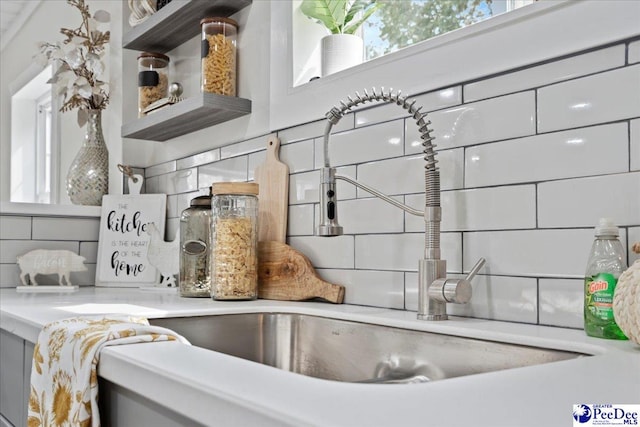 236 Wells St, Lake City, SC 29560 - room details featuring tasteful backsplash, a sink, and open shelves