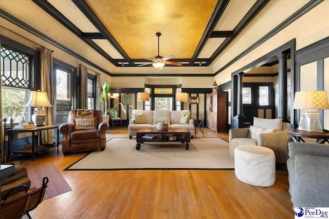 living room featuring coffered ceiling, light hardwood / wood-style floors, decorative columns, and ceiling fan