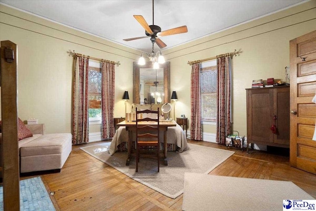 dining area featuring hardwood / wood-style floors and ceiling fan