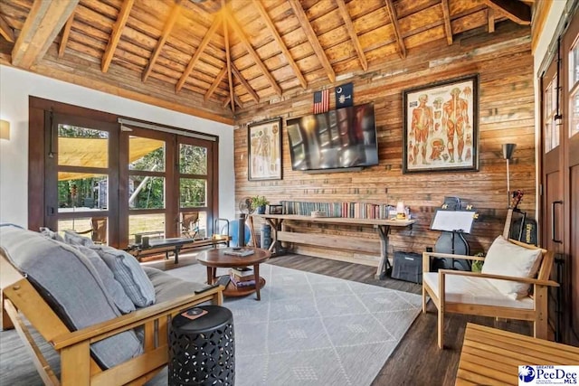 interior space featuring beamed ceiling, dark hardwood / wood-style flooring, wood ceiling, and wood walls