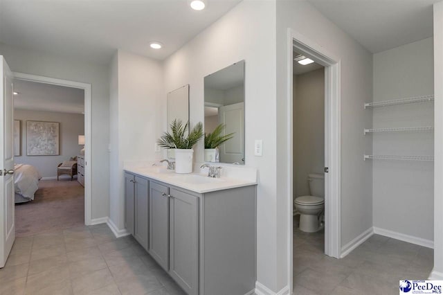 555 Strawberry Field Way, Galivants Ferry, SC 29588 - bathroom featuring double vanity, toilet, ensuite bath, tile patterned floors, and recessed lighting