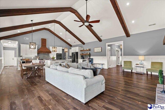 living area with a ceiling fan, dark wood-style flooring, visible vents, beam ceiling, and high vaulted ceiling