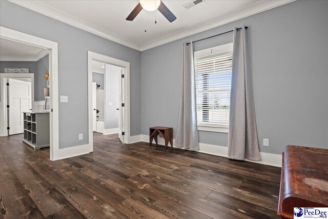 bedroom with visible vents, ornamental molding, and dark wood-style floors