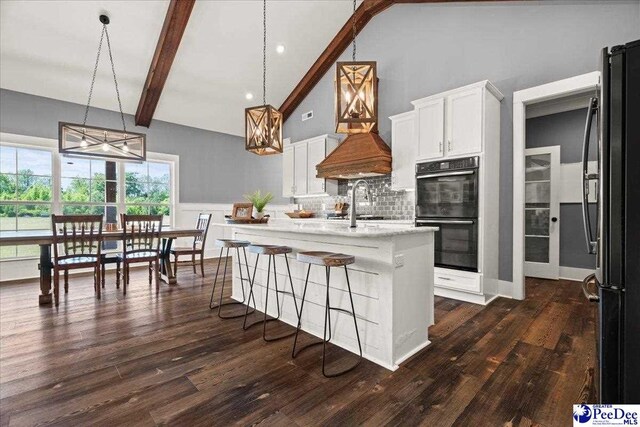 kitchen featuring decorative backsplash, dobule oven black, high vaulted ceiling, beamed ceiling, and a notable chandelier