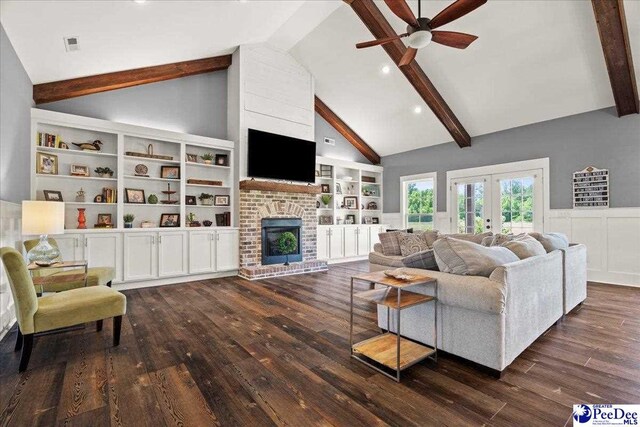 living area featuring french doors, dark wood finished floors, ceiling fan, and beam ceiling