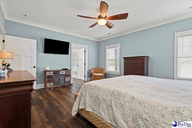 bedroom with crown molding, multiple windows, and dark wood-style flooring