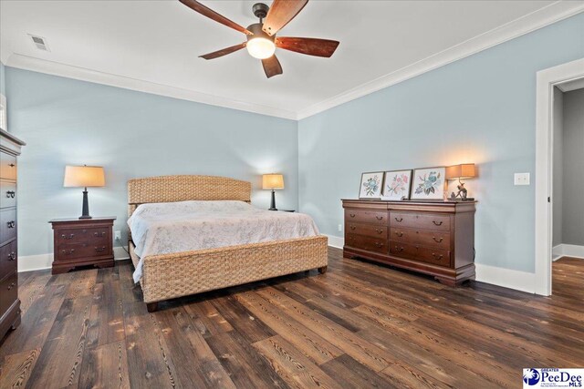 bedroom with visible vents, ornamental molding, baseboards, and wood finished floors