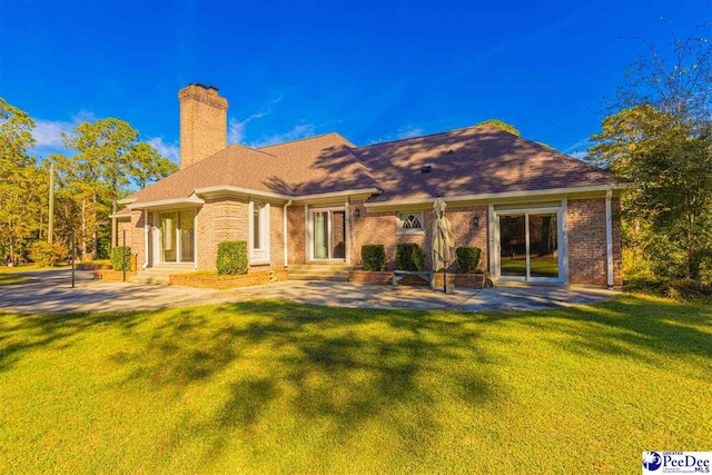 634 Georgetown Rd, Darlington, SC 29532 - back of property featuring a patio and a yard