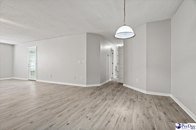 2125-D Sanderling Dr, Florence, SC 29505 - interior space with baseboards, a textured ceiling, and wood finished floors