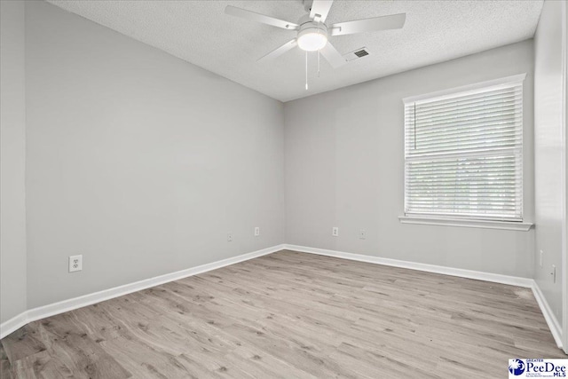 2125-D Sanderling Dr, Florence, SC 29505 - unfurnished room with wood finished floors, a textured ceiling, visible vents, baseboards, and ceiling fan