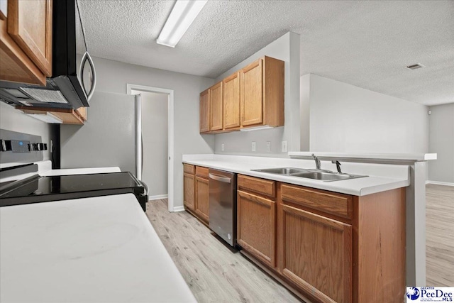 2125-D Sanderling Dr, Florence, SC 29505 - kitchen with a sink, a textured ceiling, light wood-style floors, and dishwasher