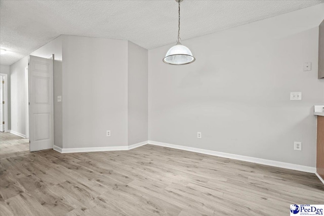 2125-D Sanderling Dr, Florence, SC 29505 - unfurnished dining area featuring a textured ceiling, baseboards, and wood finished floors