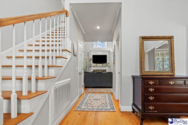 entrance foyer featuring stairway, baseboards, visible vents, recessed lighting, and light wood-type flooring