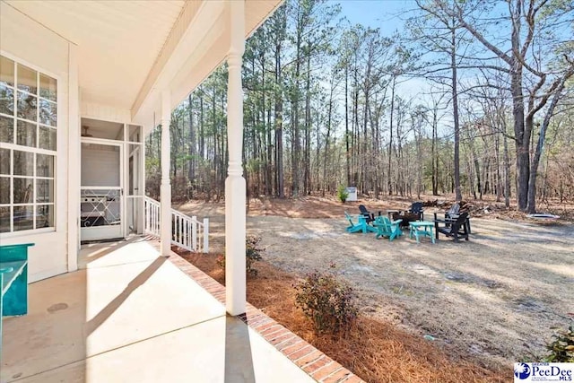 view of patio with a fire pit