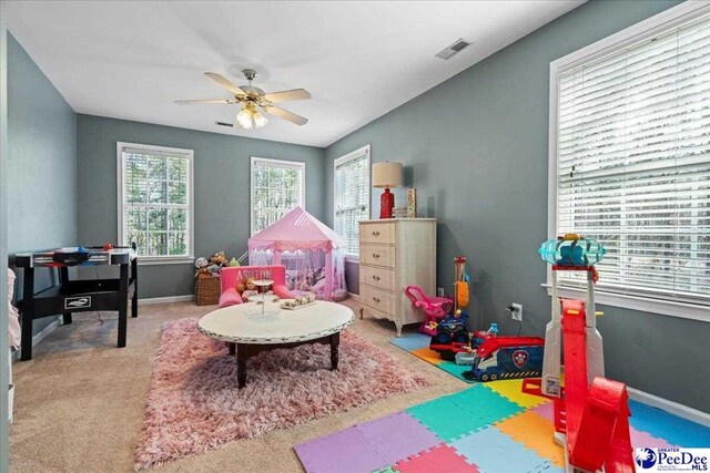 recreation room featuring visible vents, baseboards, carpet, and ceiling fan