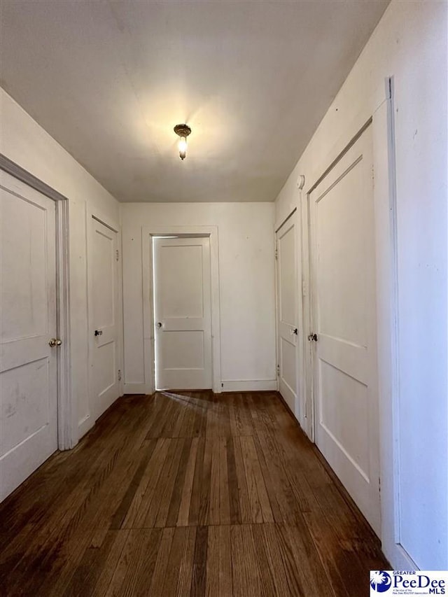 hallway featuring dark hardwood / wood-style flooring