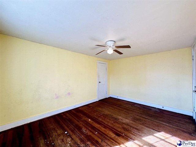 spare room with ceiling fan and hardwood / wood-style floors