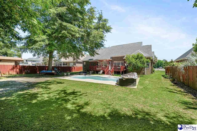 view of swimming pool featuring a deck