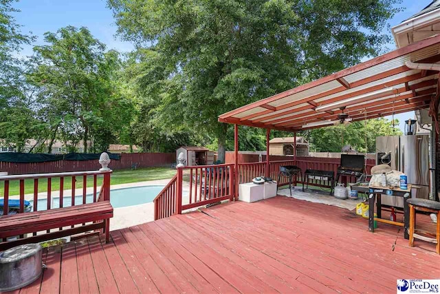 953 Rice Planters Ln, Florence, SC 29501 - wooden terrace with a storage shed, an outdoor structure, and ceiling fan
