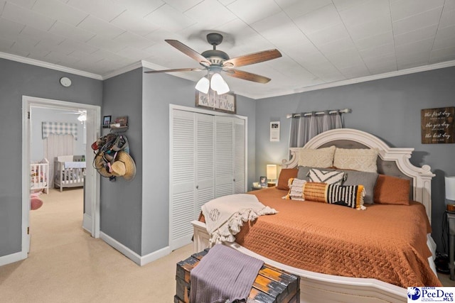 213 Newman Swamp Rd, Lamar, SC 29069 - bedroom featuring light carpet, a closet, crown molding, baseboards, and ceiling fan