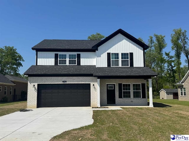 modern farmhouse featuring a front lawn, driveway, an attached garage, brick siding, and roof with shingles