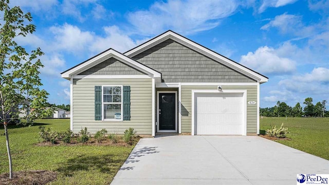 560 Strawberry Field Way, Galivants Ferry, SC 29544 - view of front facade with concrete driveway, a front yard, and an attached garage