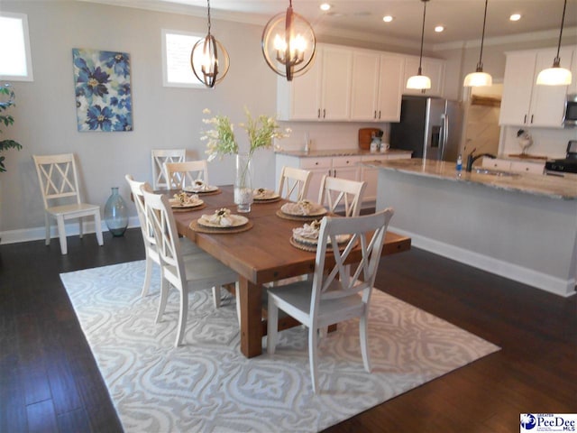 1081 Wessex Dr, Florence, SC 29501 - dining room featuring recessed lighting, a notable chandelier, dark wood-style floors, and baseboards