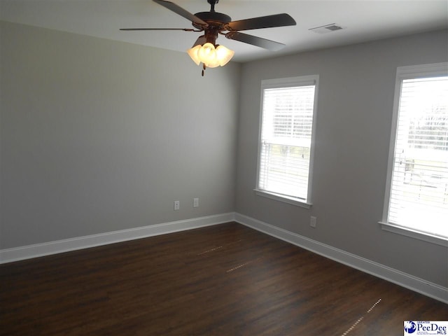1081 Wessex Dr, Florence, SC 29501 - empty room featuring visible vents, plenty of natural light, baseboards, and ceiling fan