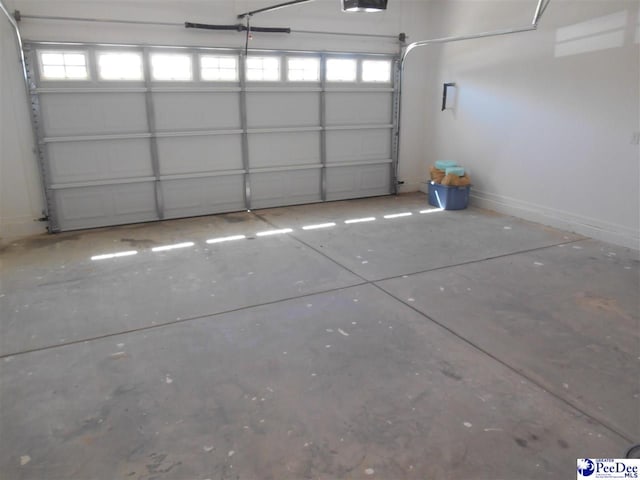 1081 Wessex Dr, Florence, SC 29501 - garage featuring baseboards and a garage door opener