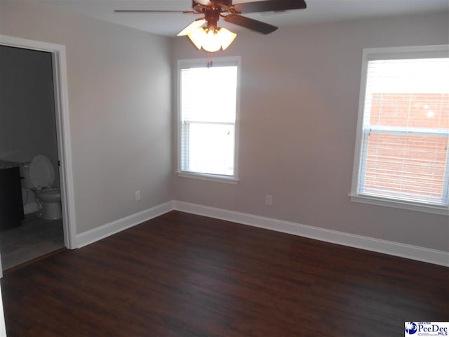 1081 Wessex Dr, Florence, SC 29501 - unfurnished bedroom featuring baseboards, dark wood-style floors, and a ceiling fan