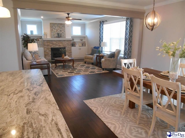 1081 Wessex Dr, Florence, SC 29501 - living area with a fireplace, ornamental molding, dark wood-style floors, and ceiling fan