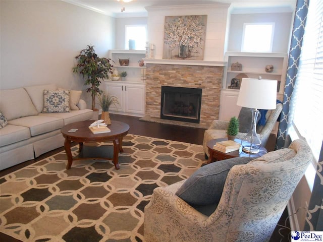 1081 Wessex Dr, Florence, SC 29501 - living area featuring wood finished floors, a fireplace with raised hearth, and ornamental molding