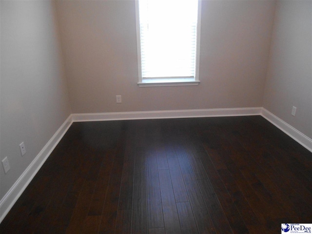 1081 Wessex Dr, Florence, SC 29501 - unfurnished room featuring baseboards and dark wood-type flooring