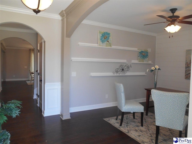 1081 Wessex Dr, Florence, SC 29501 - dining room featuring ornamental molding, a ceiling fan, wood finished floors, arched walkways, and baseboards