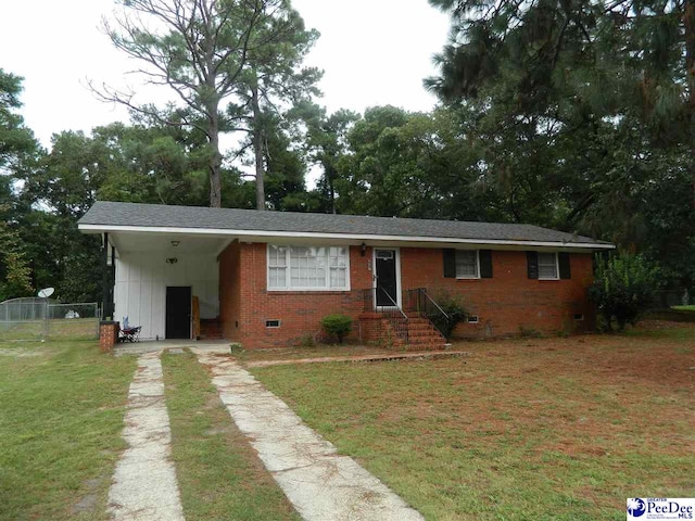 single story home with a front yard and a carport