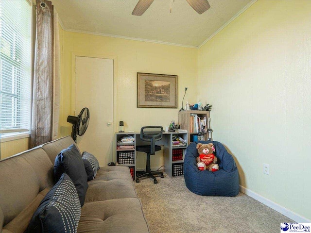 office space featuring light carpet, ornamental molding, and ceiling fan