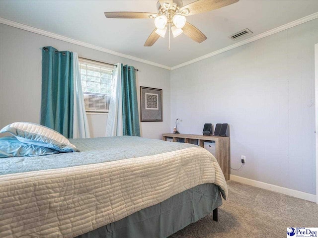 carpeted bedroom featuring crown molding and ceiling fan