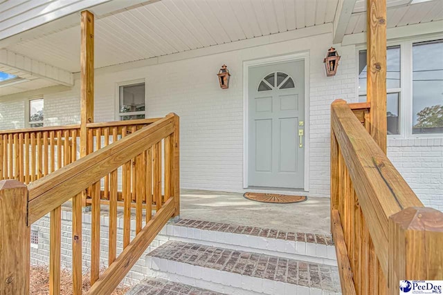 entrance to property with a porch