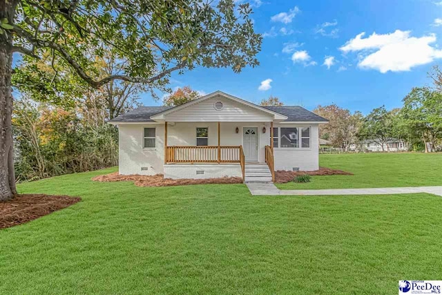 view of front facade with a front yard and a porch