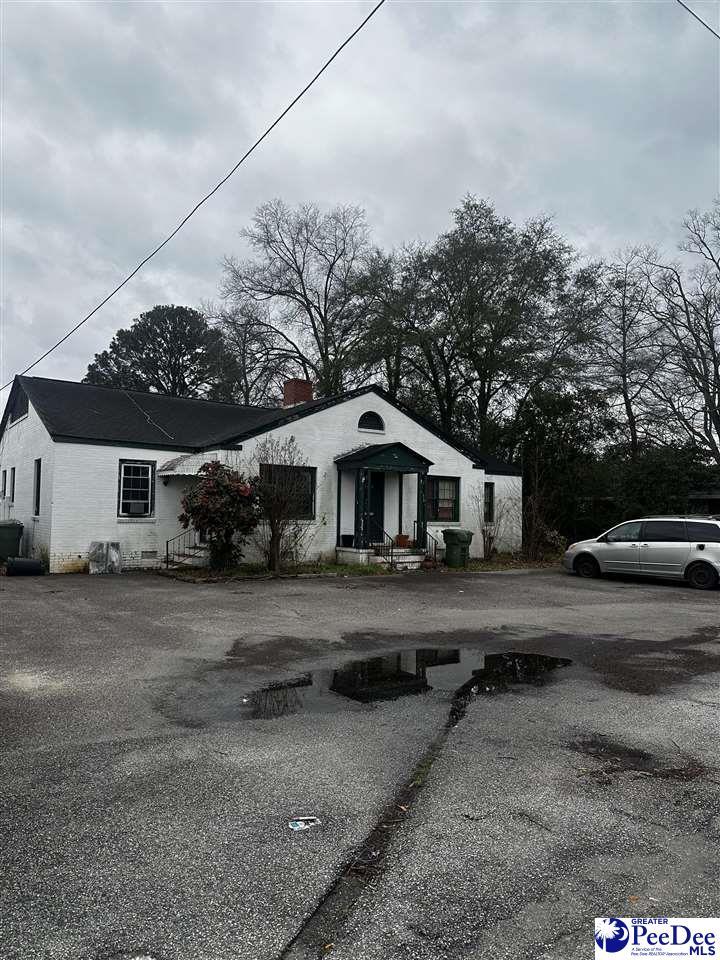 view of front of home with a chimney