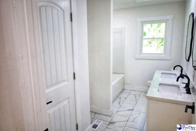 bathroom with vanity and toilet