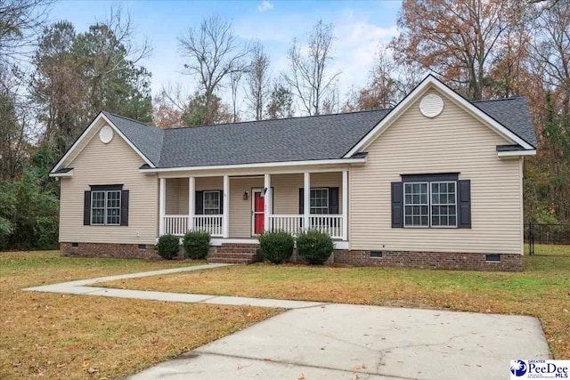 ranch-style home featuring a front yard and a porch