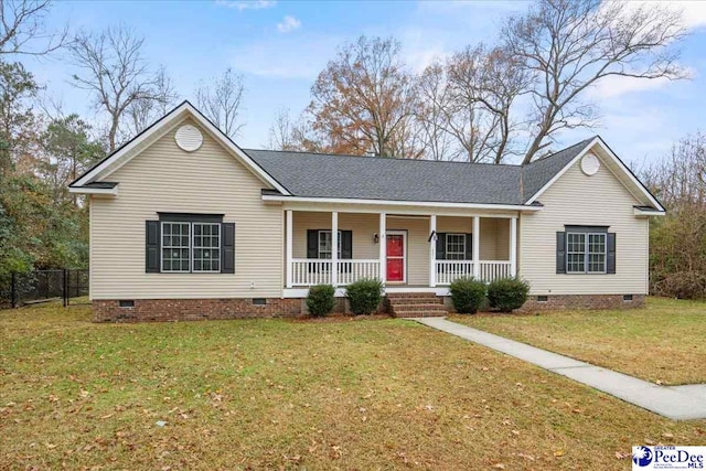 ranch-style house featuring a front yard and covered porch